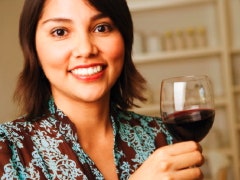 Is A Woman Selfish For Not Wanting Kids? Woman with a glass of wine