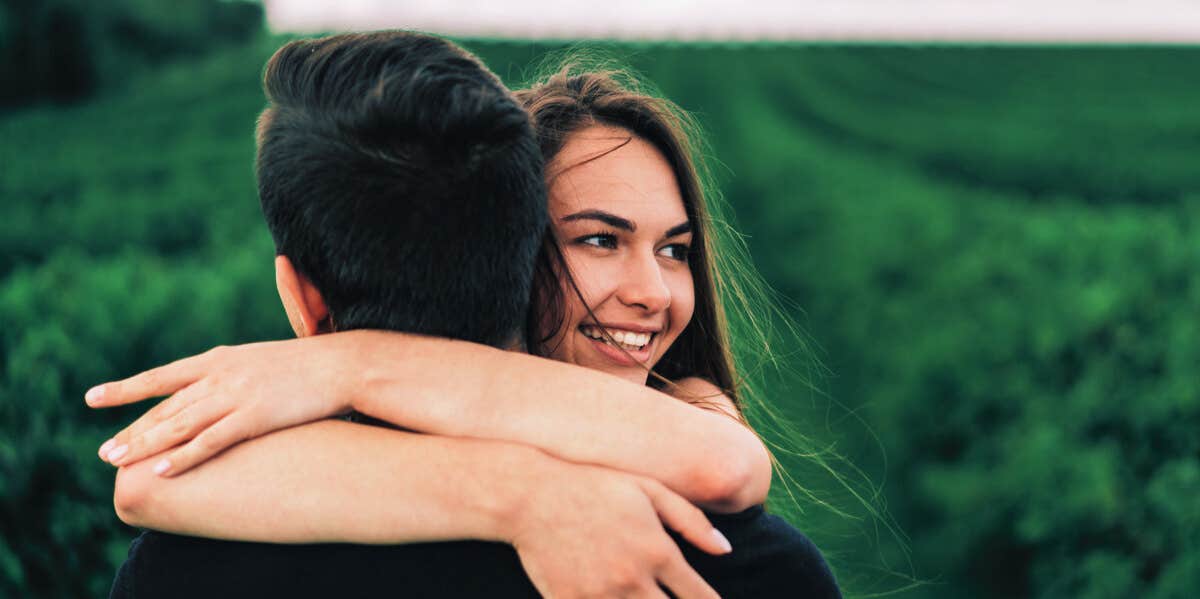 10 Traits Of A Selfless Personality smiling person hugging someone