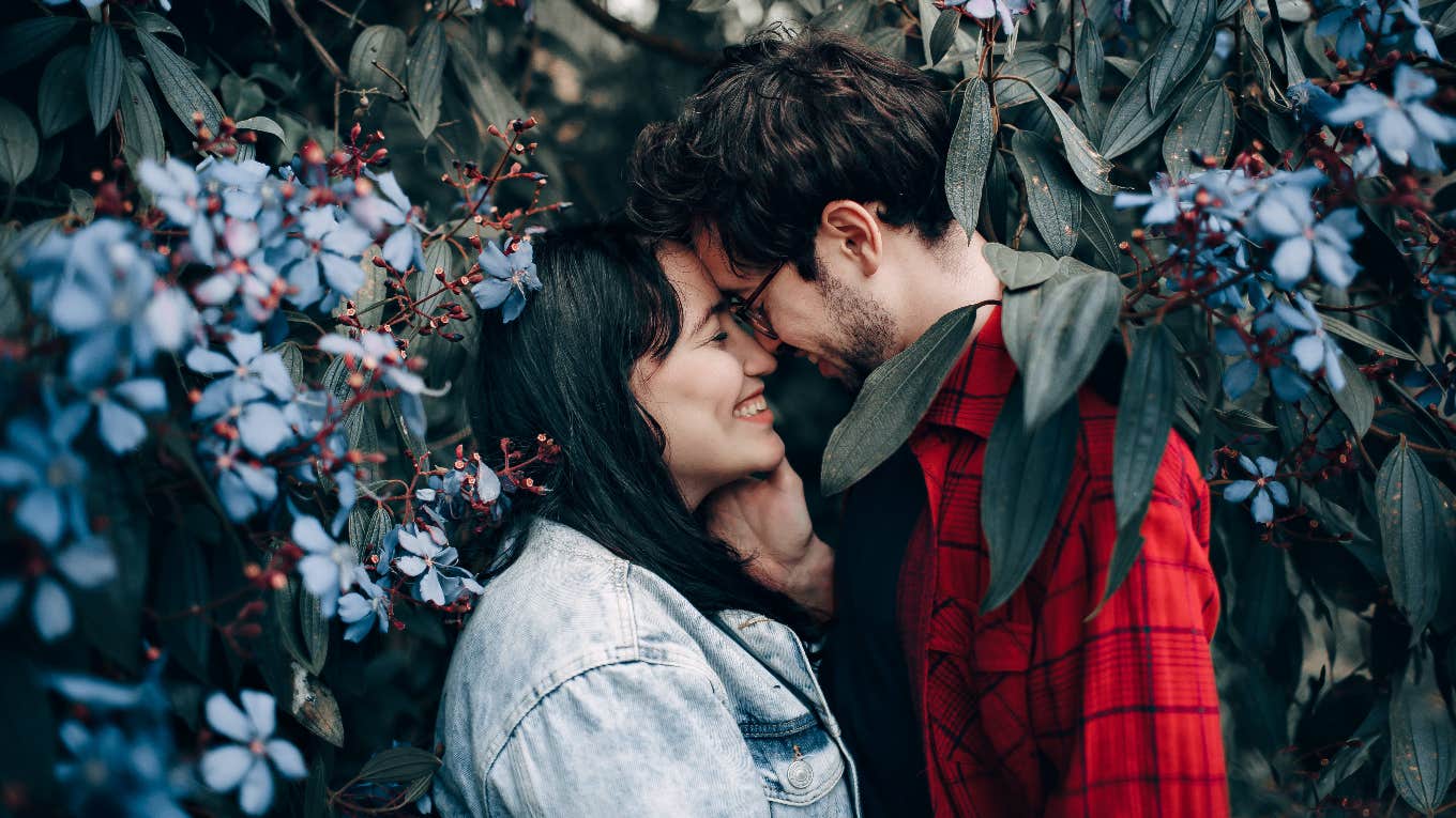 couple about to kiss in trees