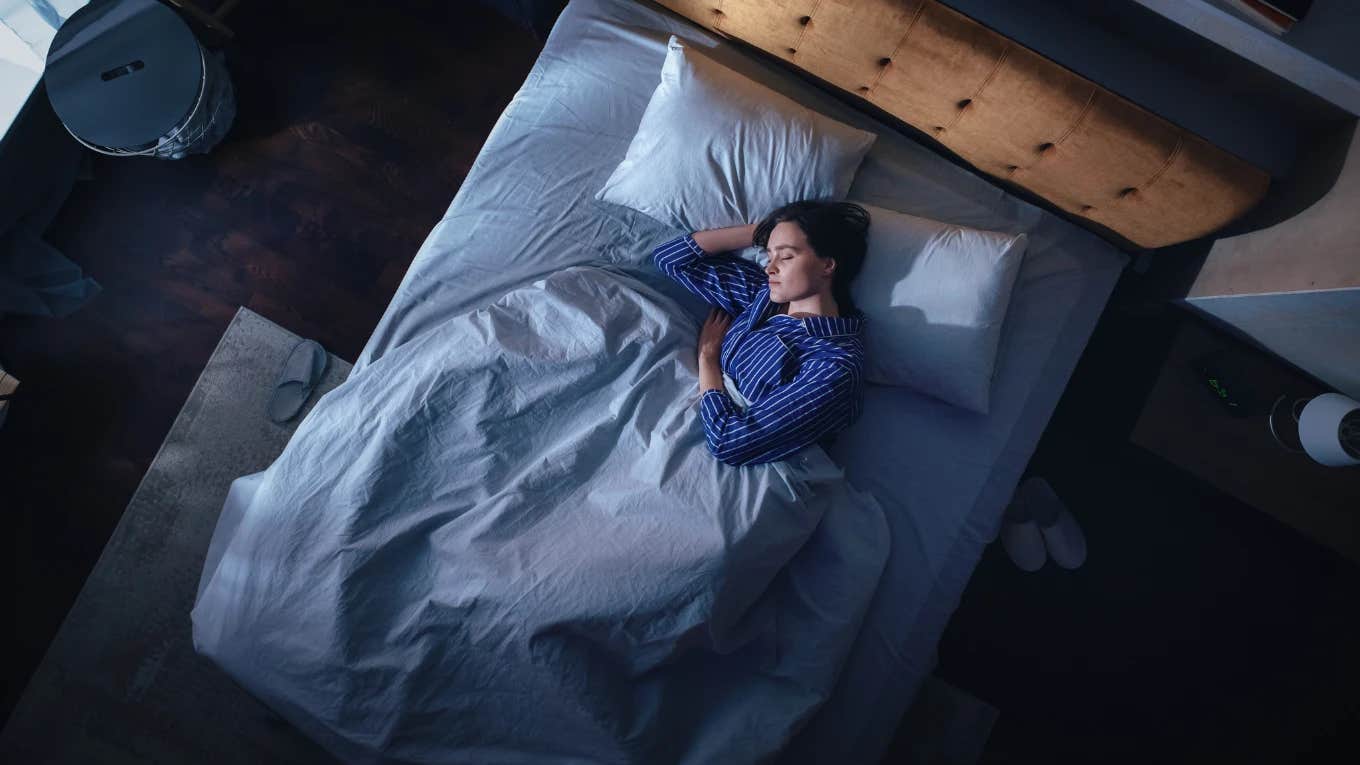Server Says She Called In Sick And Woke Up From A Nap To Find Her Boss Standing At The Foot Of Her Bed top view of woman sleeping in bed