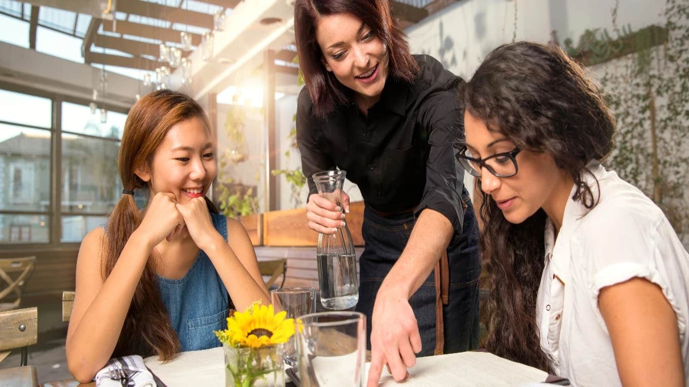 waitress talking to customers