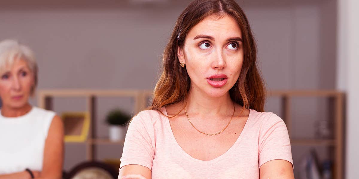 unhappy girl ignoring mother in law