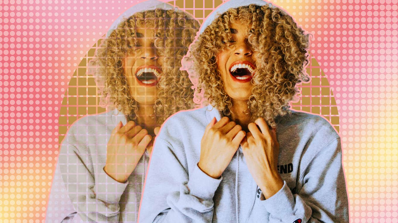 7 Tiny Habits Of People With Insane Amounts Of Energy Woman smiling full of energy