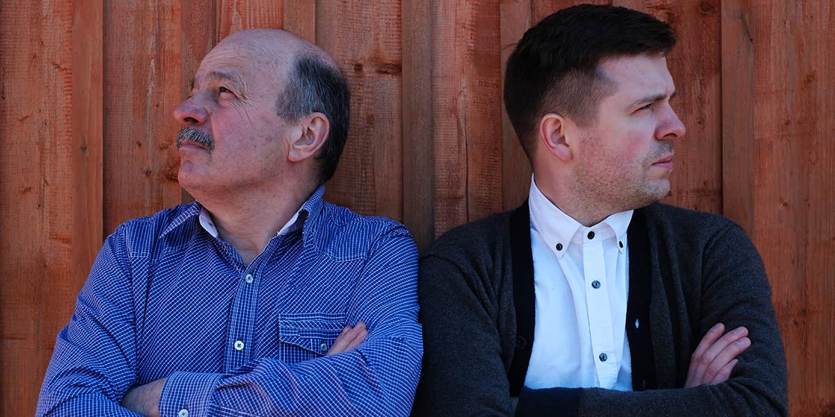 7 Subtle Signs Your Dad Hates Your Husband father in law and son in law with arms crossed