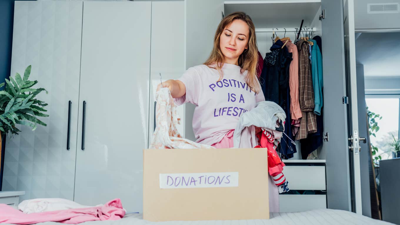 woman decluttering to become a minimalist
