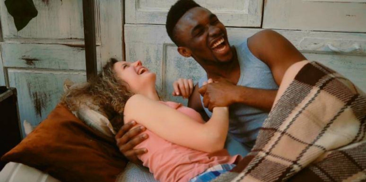 sex and emotions laughing couple in bed