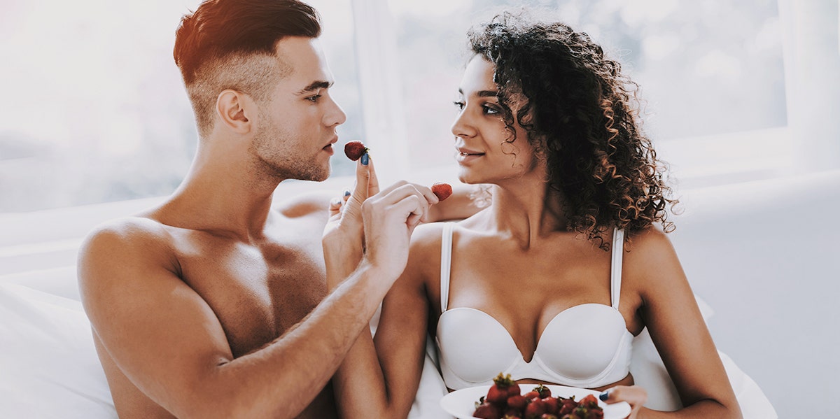 couple feeding each other food foreplay