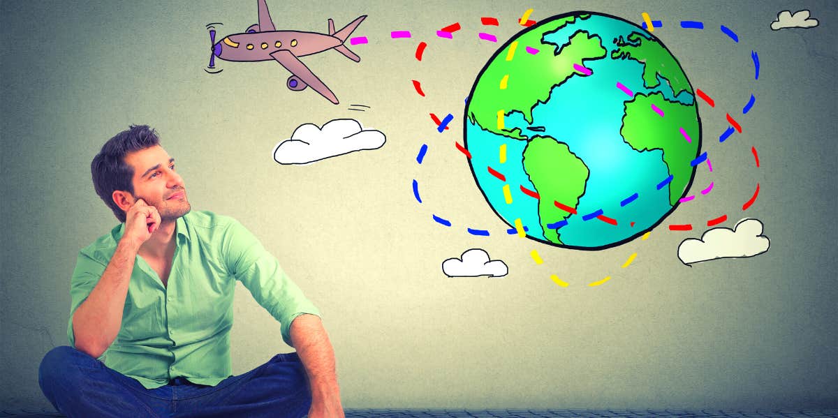 The World's Sexiest Accents, According To 5,000 Women man looking at an image of a plane circling the globe
