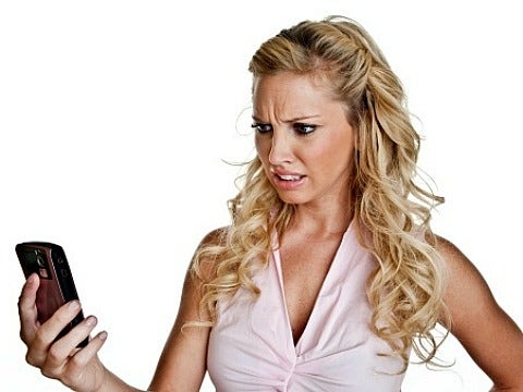woman confused at cell phone