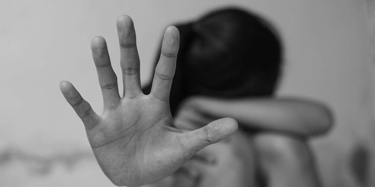 To My Fellow Sexual Assault Survivors: It's Time We Share Our Stories woman with hand up