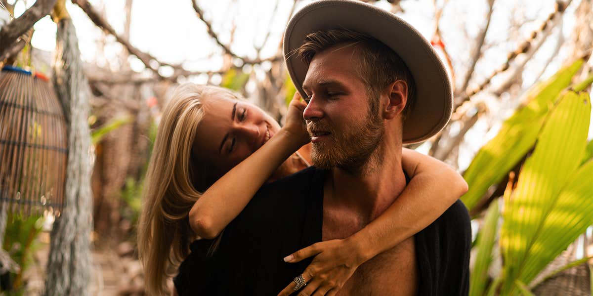 woman hugging man from behind