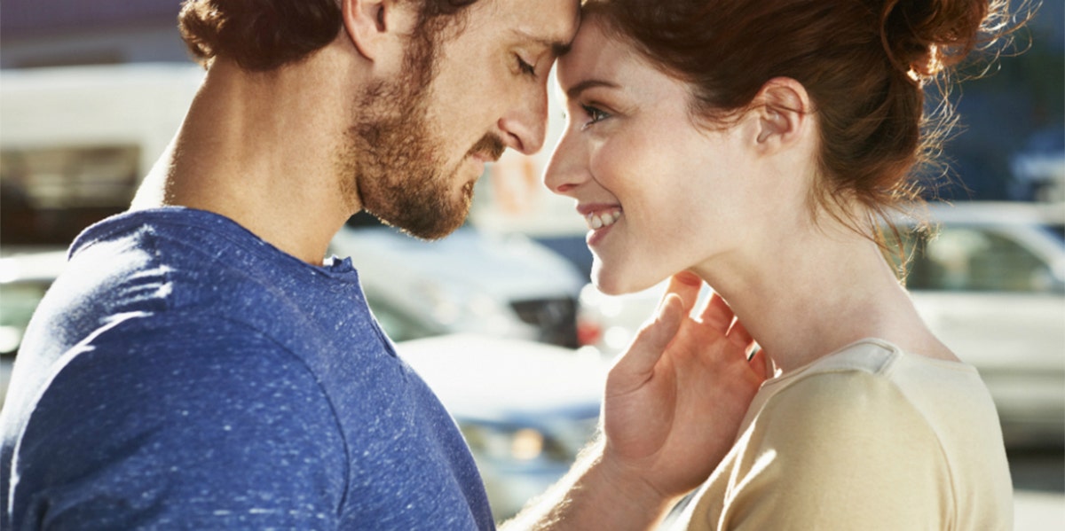 man and woman touching foreheads