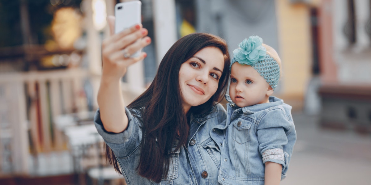 mom taking selfie with baby