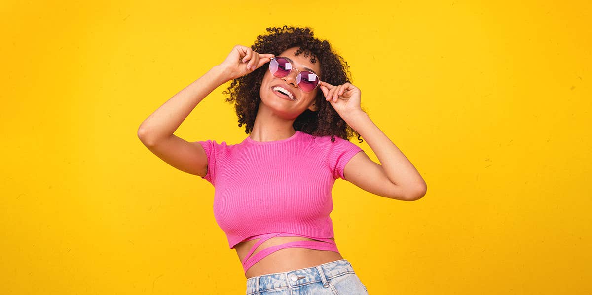 woman with glasses cut shirt