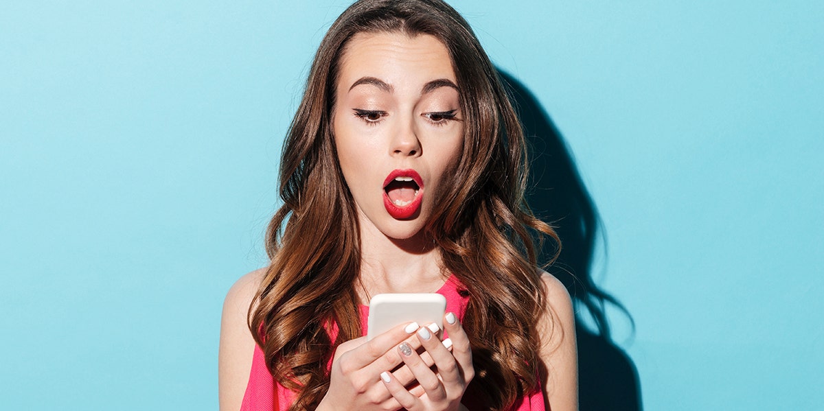 125 Random Fun Facts So Interesting You’ll Be Amazed Woman looking at phone shocked by fun facts