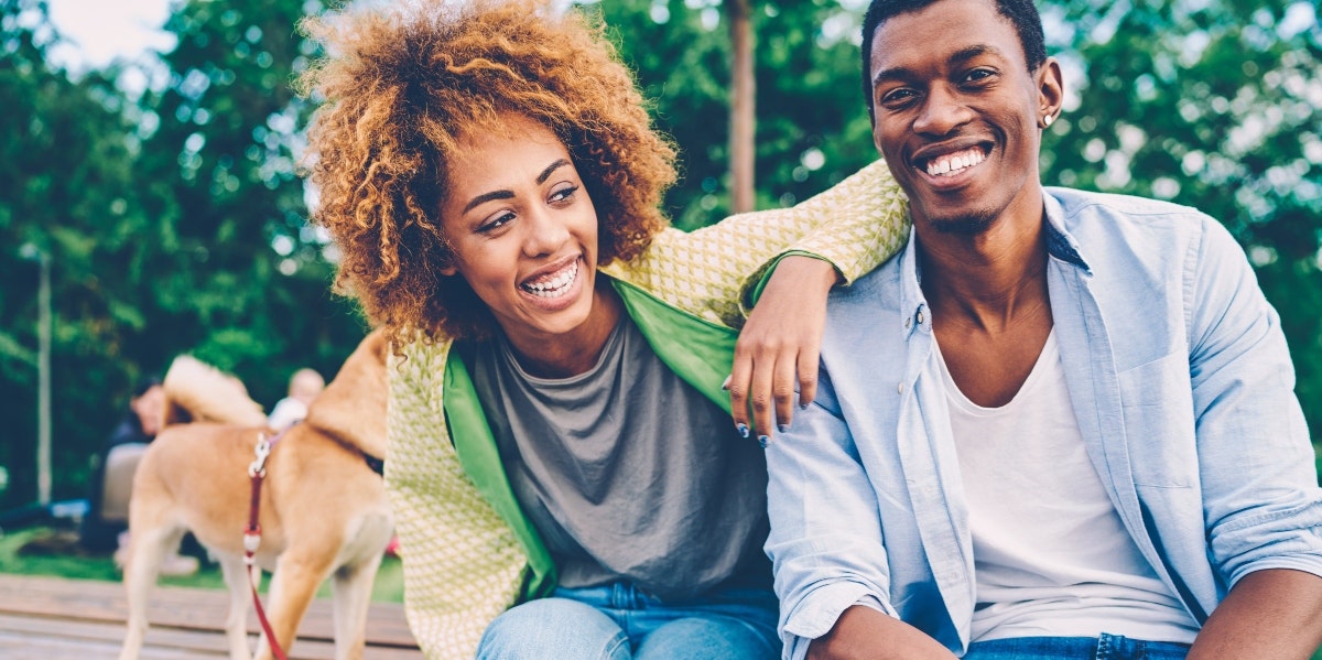 women and a man smiling