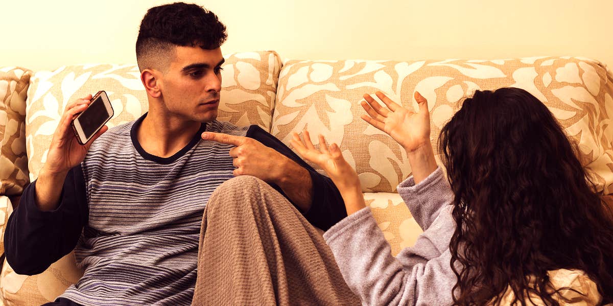 7 Signs Your Relationship Isn't As Healthy As You Think young couple arguing on couch