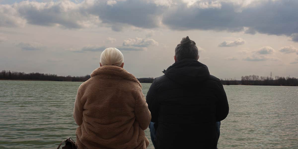 man and woman sitting together