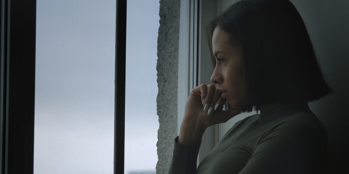 The 4 Most Important Questions To Ask Yourself Before Deciding To Get Divorced sad woman looking out window