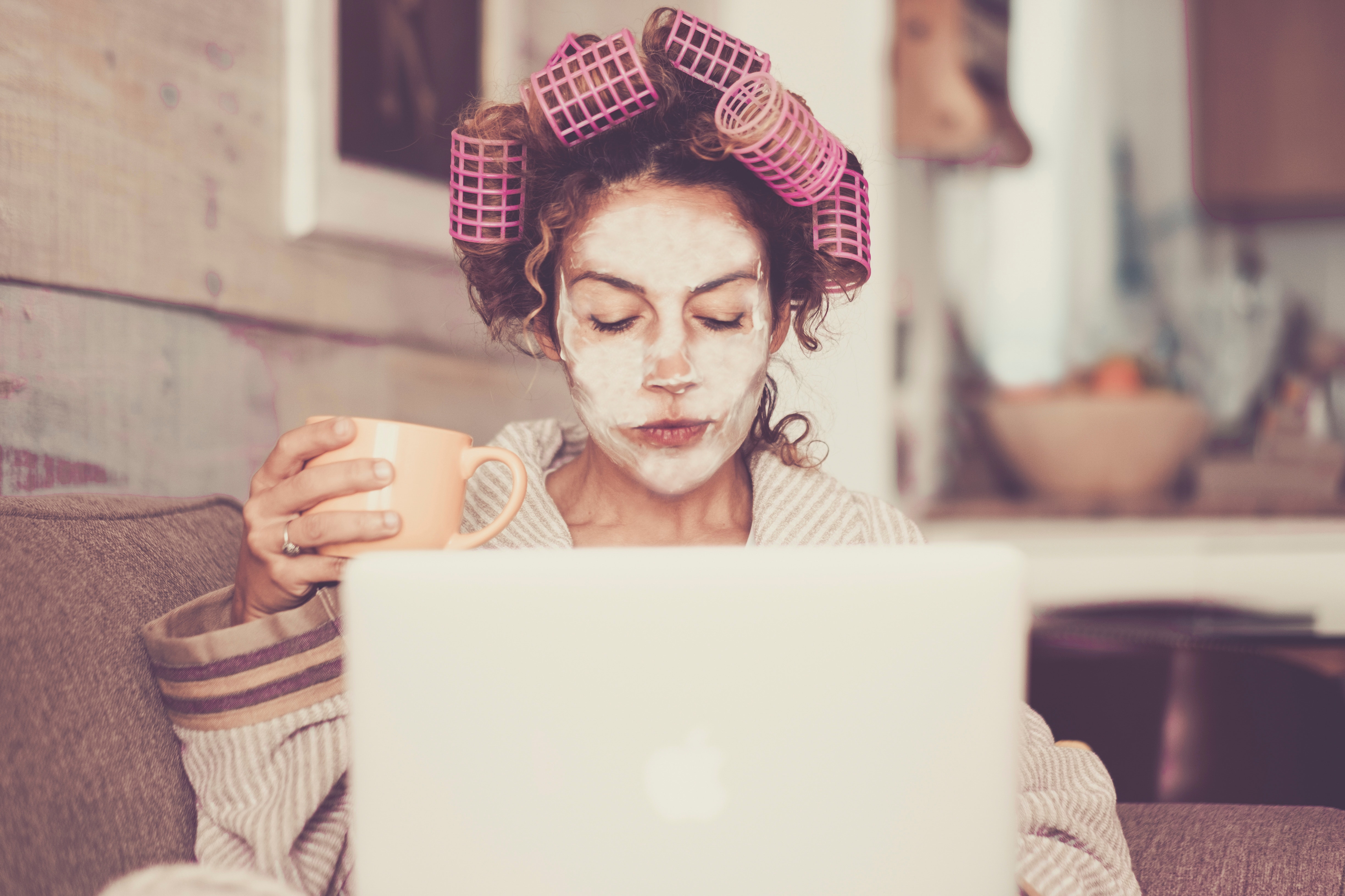 woman working at home in curlers