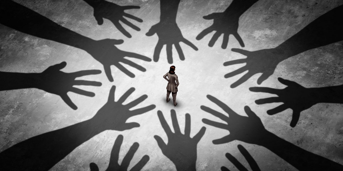 woman standing alone with hands reaching for her