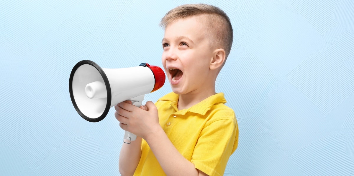 boy yelling through megaphone