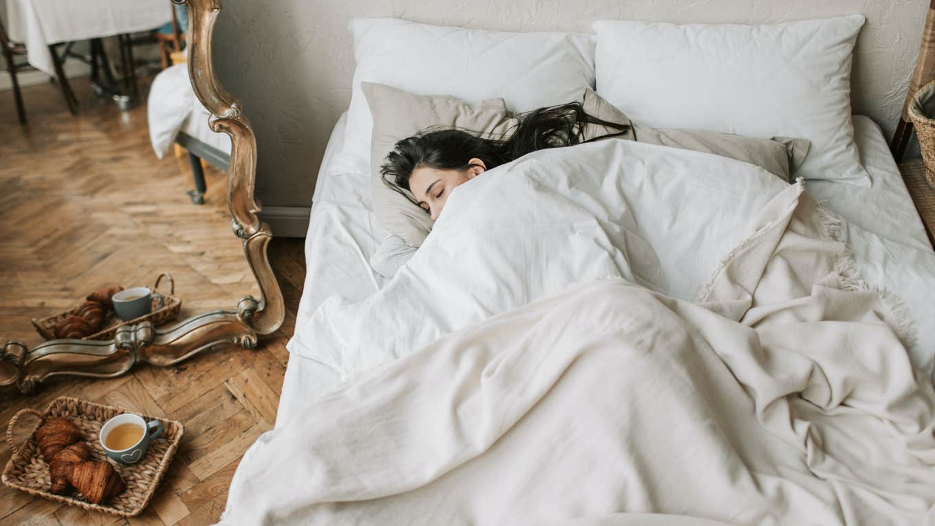 What The Side Of The Bed You Sleep On Says About Your Personality woman asleep in bed