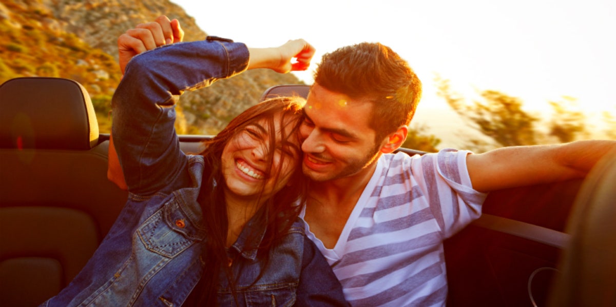 couple laughing in car