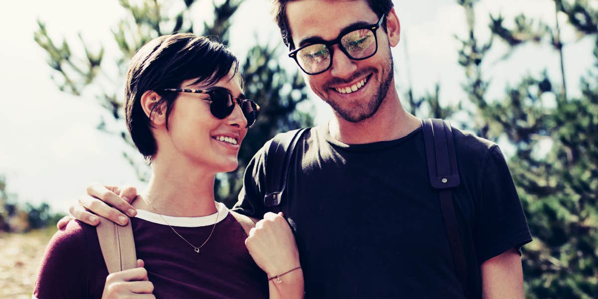 signs a man is truly committed couple hiking