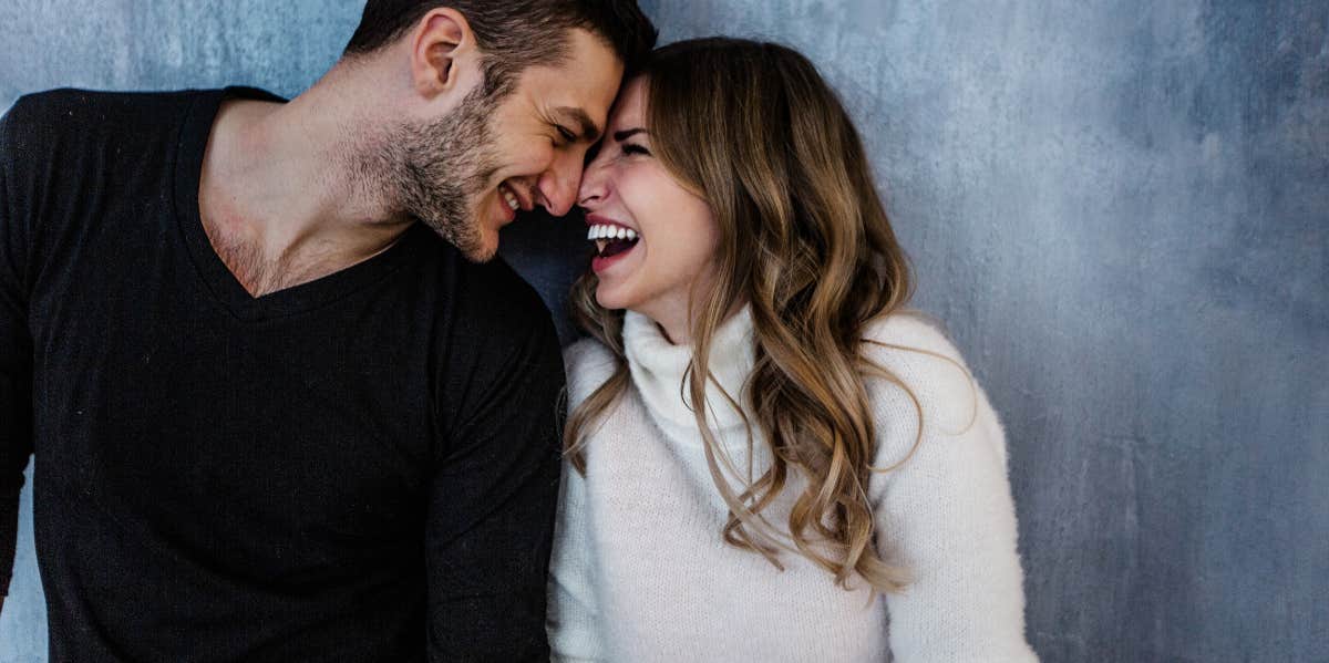 man looking at woman he is falling in love with smiling