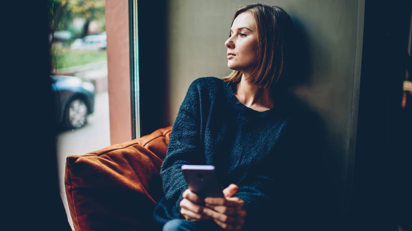 woman looking out the window