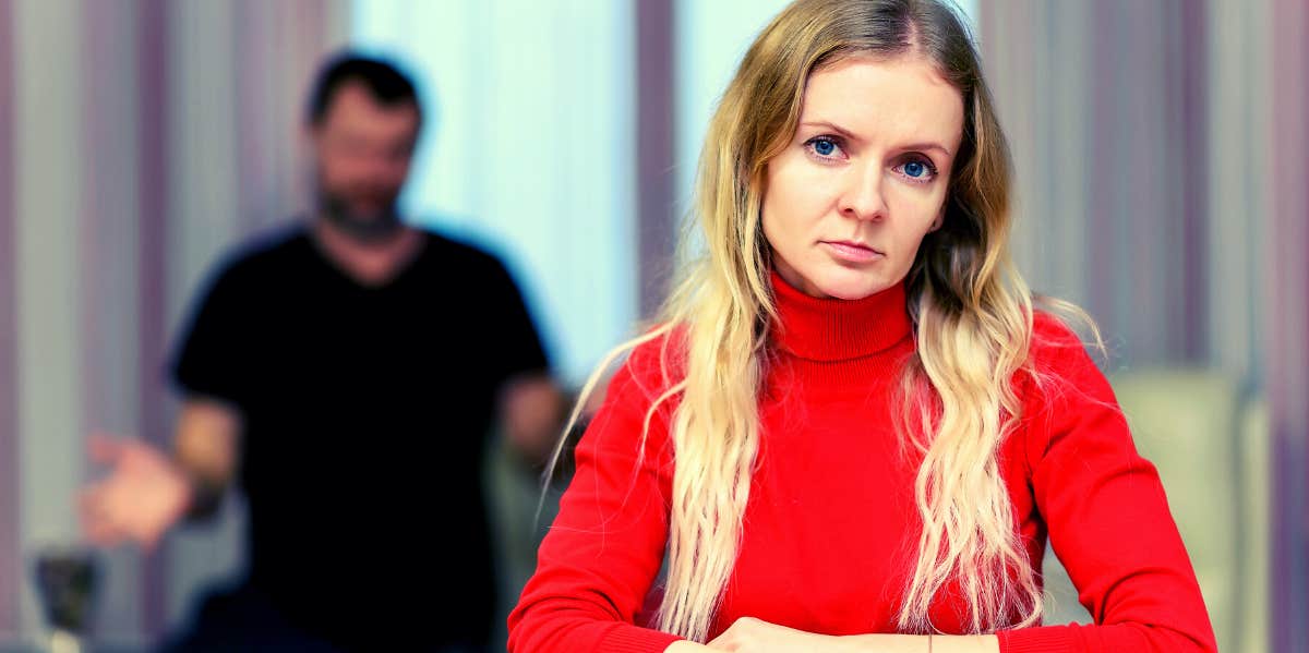 15 Warning Signs Of A Controlling Husband upset woman with controlling man behind her