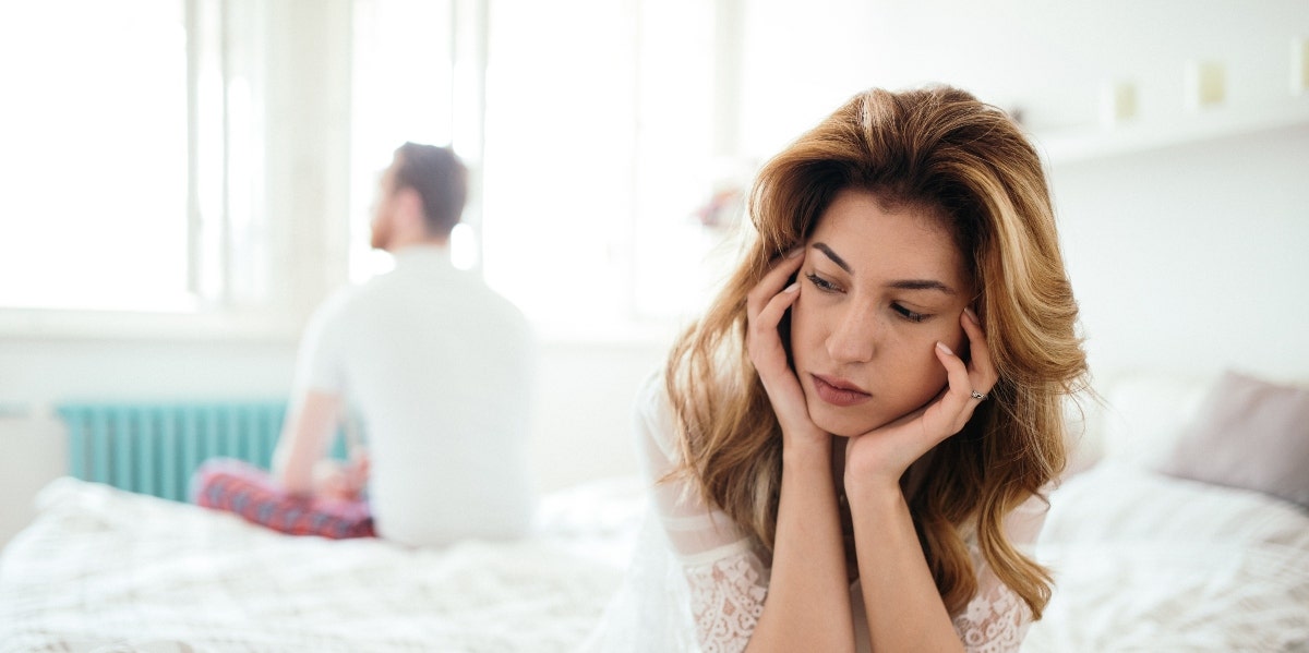 7 Signs Of Emotional Abuse In A Relationship You Can't Ignore man and woman struggling with emotional abuse