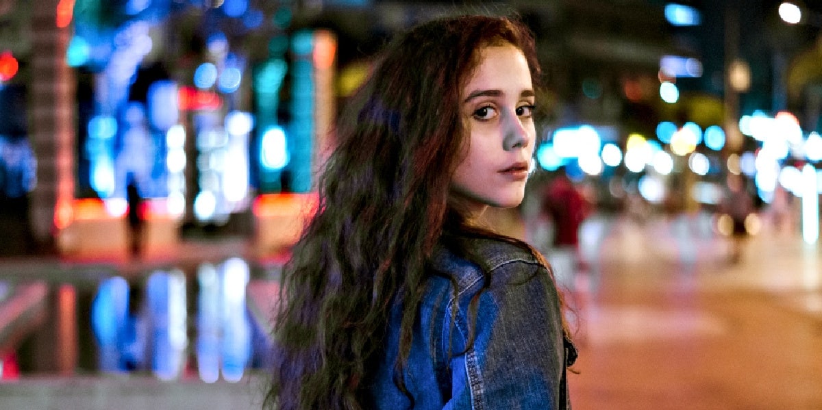 10 Signs Your Ex Will Eventually Come Back woman in leather jacket looking back
