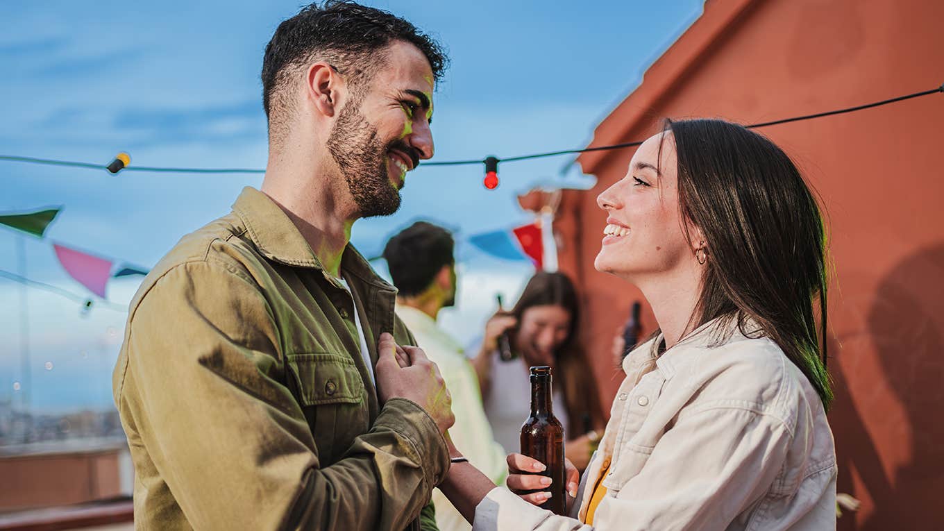 4 Little Signs He Wants A Serious Relationship With You man and woman flirting