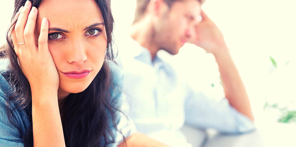 10 Major Warning Signs He's The Wrong Guy For You frustrated woman sitting next to man she's dating who's the wrong guy for her