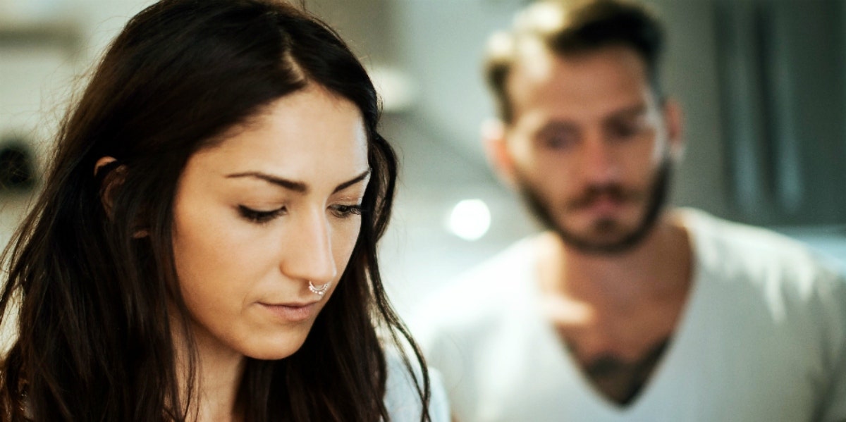 woman upset with man in the background