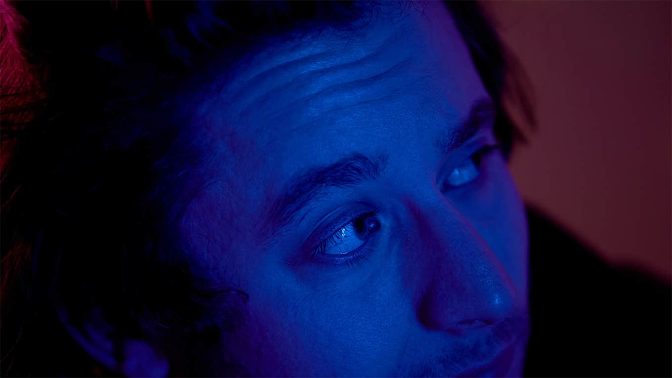 Psychologist Reveals 7 Signs You Have Low Emotional Intelligence guy listening to headphones in the dark