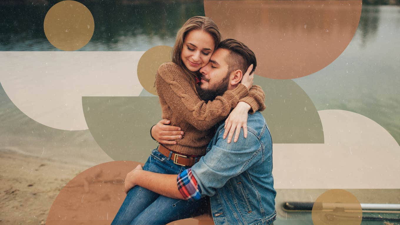 Couple hugging by the lake