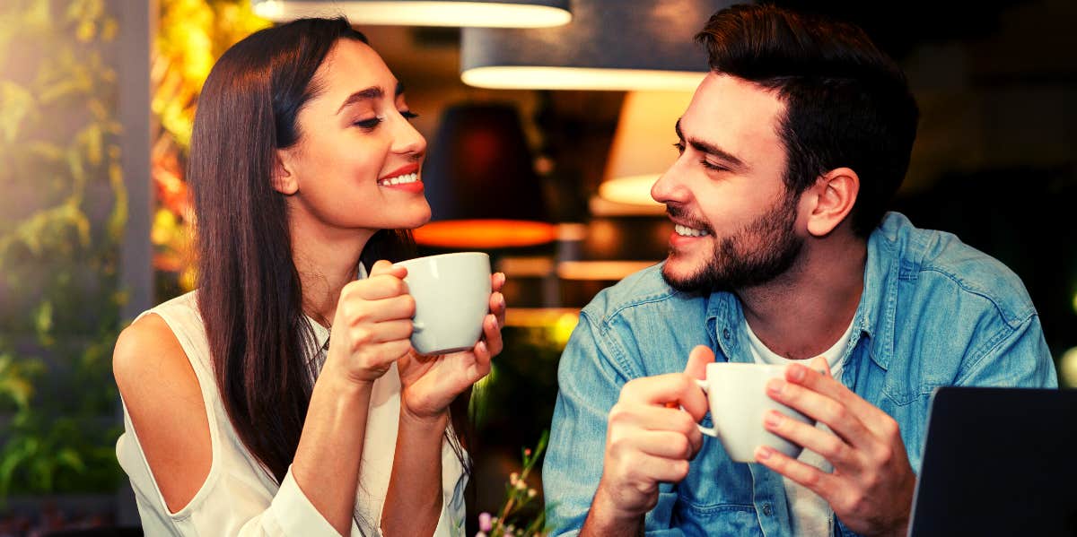 man and woman smiling at each other on a date
