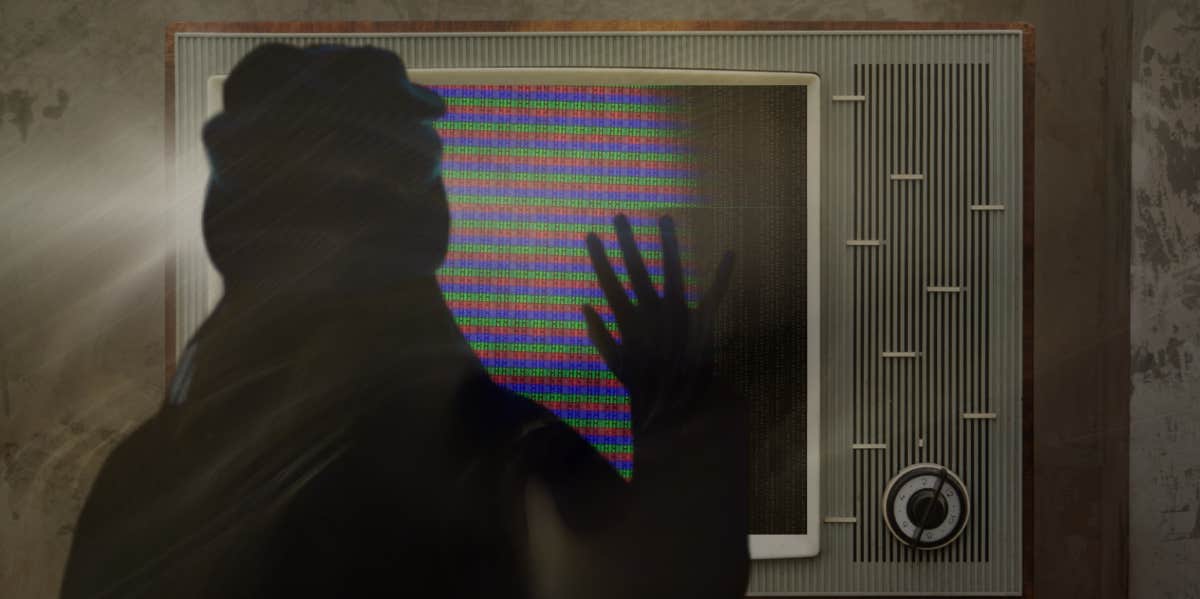 woman with hand on the tv poltergeist