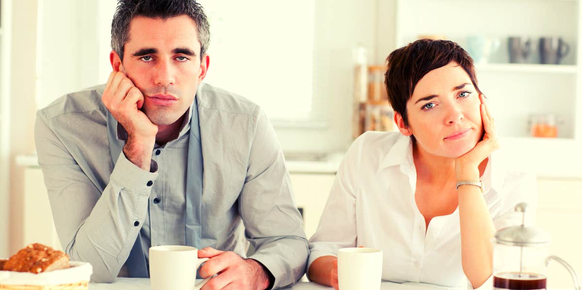 15 Top Signs Of An Unhappy Marriage unhappily married couple staring straight ahead
