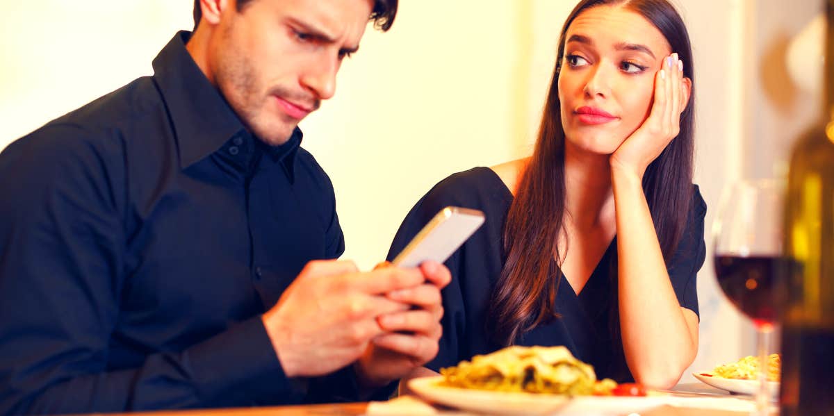 16 Warning Signs Of Divorce To Pay Attention To woman thinking about divorce while sitting next to her husband looking at his phone