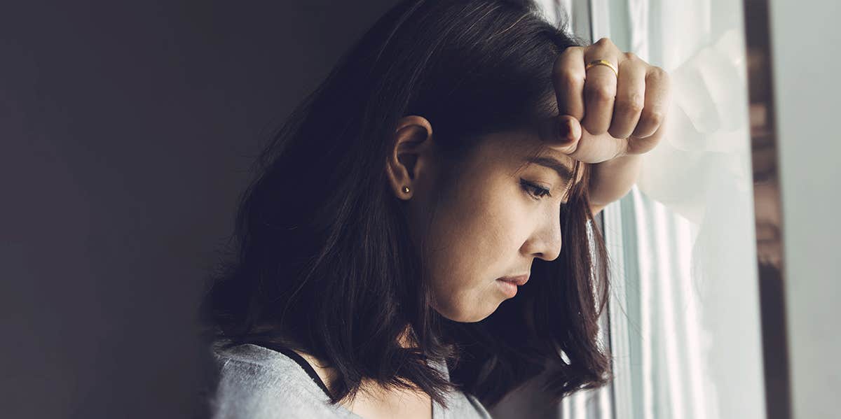 Rare Signs You're Suffering From PTSD depressed woman