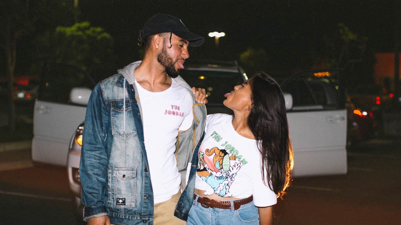 3 Tiny Signs Your Guy Is An Absolute Keeper Couple being silly outside