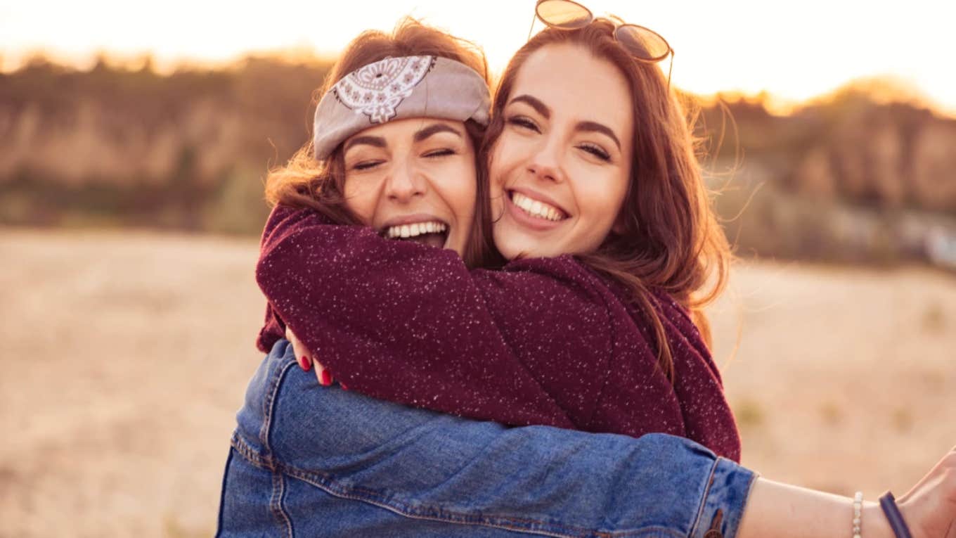 friends hugging smiling