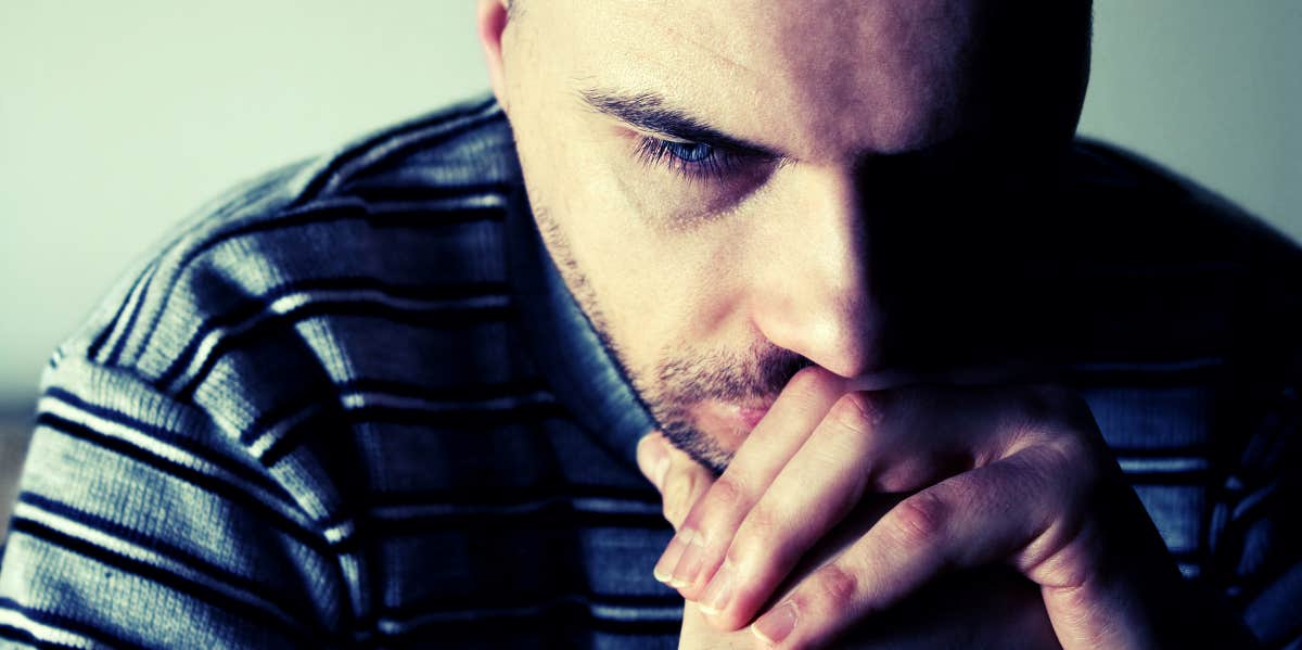 13 Signs You Hurt Your Partner’s Feelings And How To Make Things Right upset man looking down and thinking over folded hands
