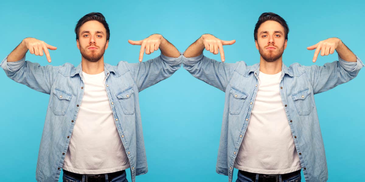 arrogant man pointing to himself in front of blue background