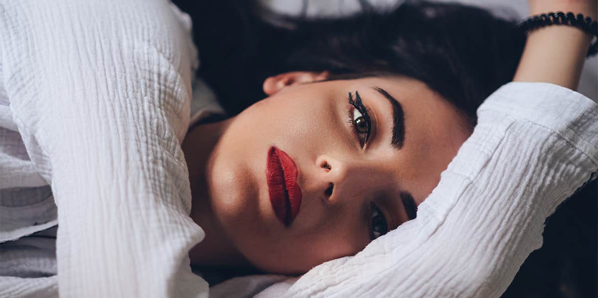 5 Signs You Were Emotionally Neglected By Your Dad (And It's Affecting You Now) girl lying alone