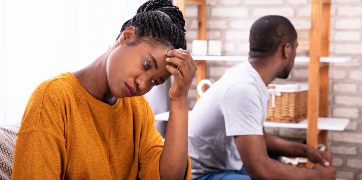 couple turned away from each other on couch